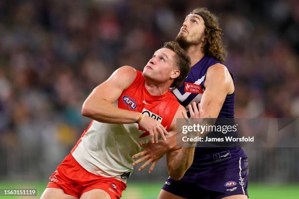 Hayden McLean of the Swans and Luke Jackson of the Dockers contest the ruck during the round 19 AFL match between Fremantle Dockers and Sydney Swans...