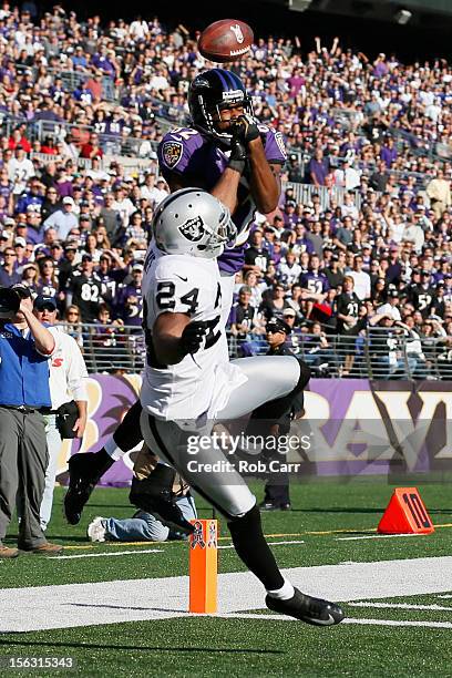 Cornerback Michael Huff of the Oakland Raiders breaks up a pass intended for wide receiver Torrey Smith of the Baltimore Ravens at M&T Bank Stadium...