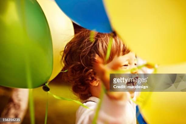little boy between colorful balloons. - gas balloons bildbanksfoton och bilder