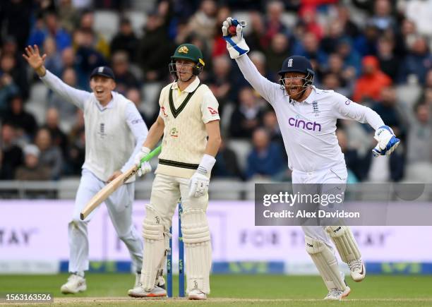 Jonny Bairstow and Zak Crawley of England appeal for the wicket of Marnus Labuschagne of Australia which is given out after a DRS review during Day...