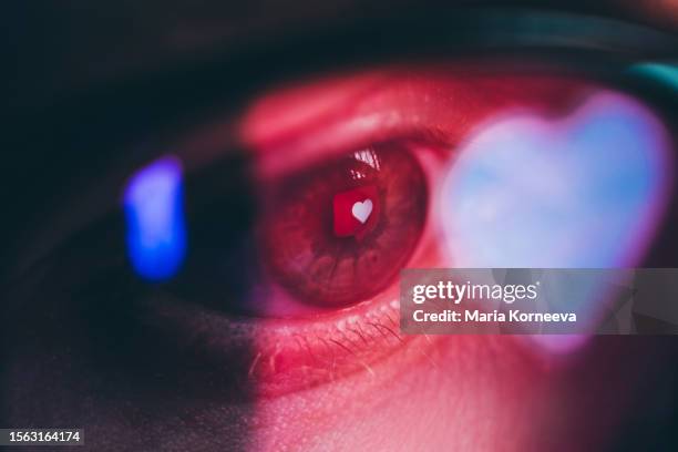 woman with a heart reflected in her eyes. - amore foto e immagini stock