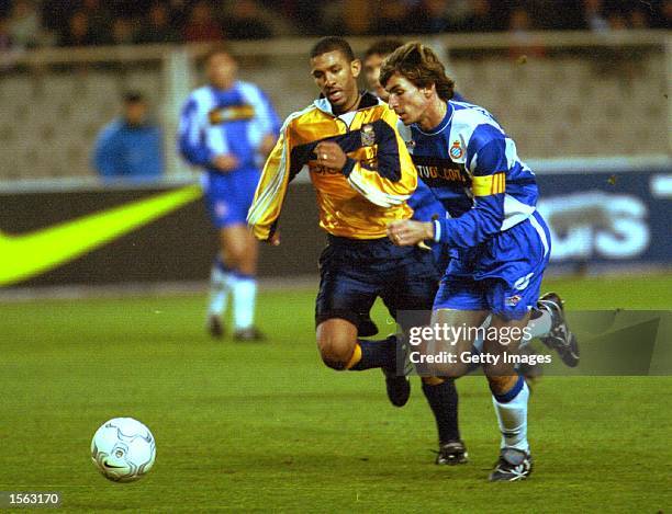 Moises Arteaga of Espanyol runs with the ball pursued by Djalminha of Deportivo during the Espanyol Barcelona v Deportivo La Coruna Primera Liga...