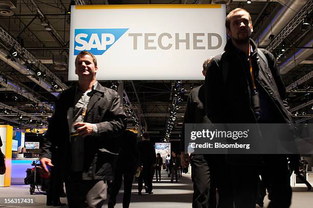 Visitors pass beneath a SAP TechEd banner in a hall on the opening day of the Sapphire Now and TechEd conference in Madrid, Spain, on Tuesday, Nov....