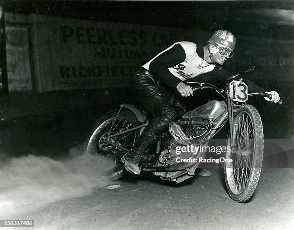 Motorcle Rider Sliding A rider broad slides through a corner on an Indian motorcycle during ...