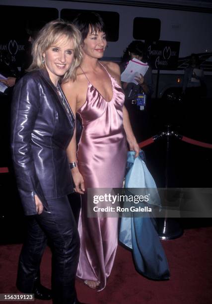 Singer Melissa Etheridge and girlfriend Julie Cypher attend the 27th Annual American Music Awards on January 17, 2000 at the Shrine Auditorium in Los...