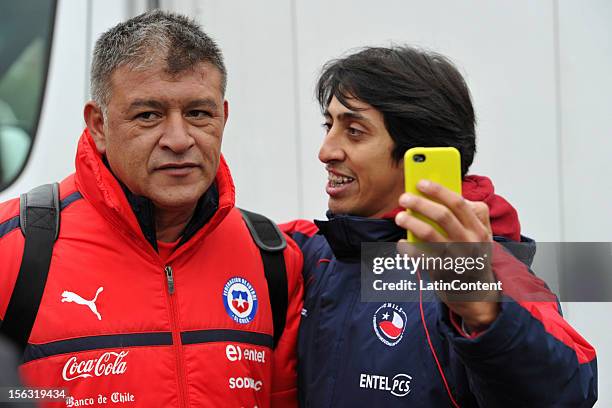 Argentine coach of Chile Claudio Borghi poses for a picture with a Chilean fan after a training at Spiserwies stadium November 13, 2012 in Sait...