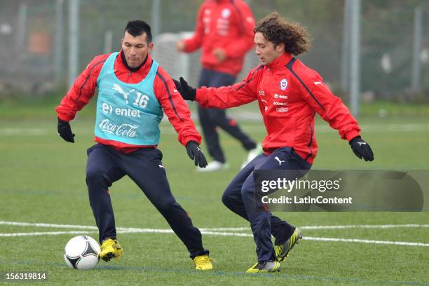 Gary Medel and Manuel Iturra of Chile during a training at Spiserwies stadium November 13, 2012 in Saint Gallen, Switzerland. Chile will play a...