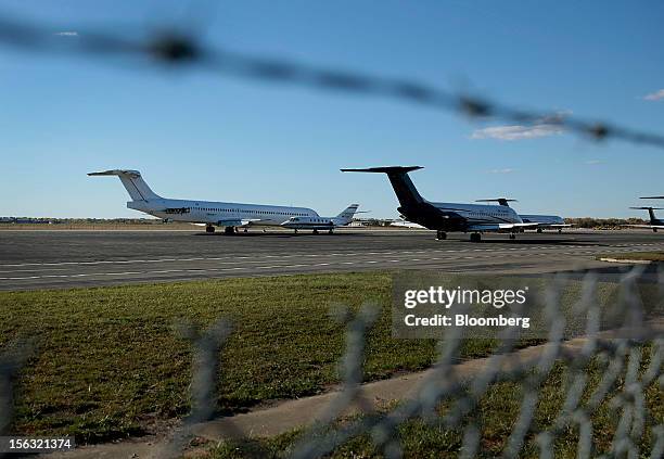 Airplanes that have had their engines removed sit on the tarmac at Willow Run Airport in Ypsilanti, Michigan, U.S., on Friday, Oct. 14, 2012. Willow...