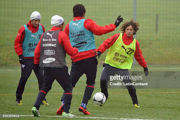 Manuel Iturra of Chile conducts the ball during a training session at Spiserwies stadium November 13, 2012 in Sait Gallen, Switzerland. Chile will...