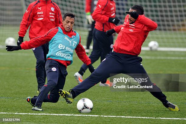 Alexis Sanchez and Jean Beausejour of Chile fight for the ball during a training at Spiserwies stadium November 13, 2012 in Sait Gallen, Switzerland....