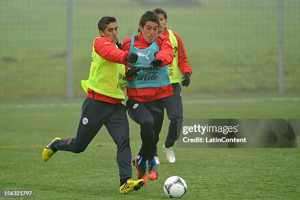 Charles Aranguiz and Enzo Andia of Chile fight for the ball during a training at Spiserwies stadium November 13, 2012 in Sait Gallen, Switzerland....