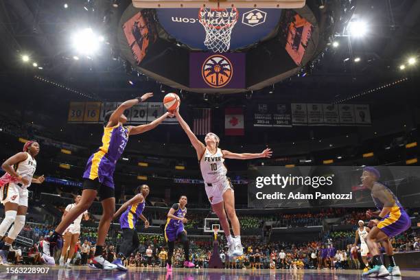 Azura Stevens of the Los Angeles Sparks and Lexie Hull of the Indiana Fever reach for a loose ball during the game on July 27, 2023 at Crypto.Com...