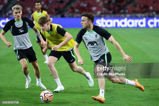 Diogo Jota of Liverpool trains with teammates ahead of the pre-season friendly match between Liverpool and Leicester City at National Stadium on July...