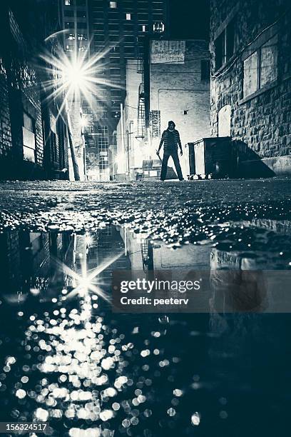 dangerous alley. - gang crime stock pictures, royalty-free photos & images