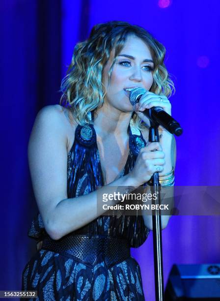 Miley Cyrus performs on stage at Muhammad Ali's Celebrity Fight Night XVIII on March 24, 2012 in Phoenix, Arizona. The event supports the fight...