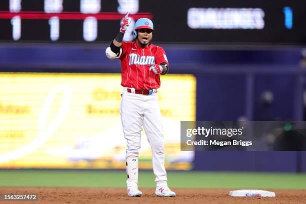 Luis Arraez of the Miami Marlins reacts after hitting a double against the Colorado Rockies during the third inning of the game at loanDepot park on...
