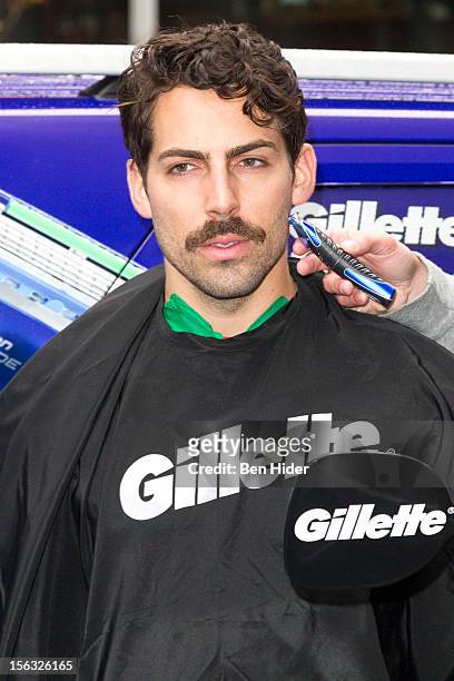 Man is shaved to create a moustache at the Gillette "Movember" Event on November 13, 2012 in New York City.