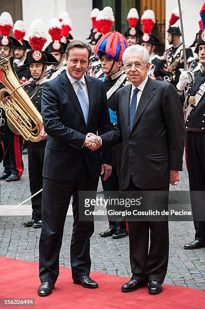 British Prime Minister David Cameron shakes hands with Italian Prime Minister Mario Monti prior a meeting at Palazzo Chigi on November 13, 2012 in...
