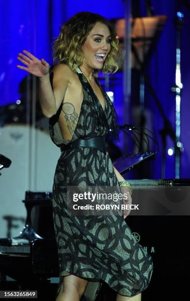 Miley Cyrus performs on stage at Muhammad Ali's Celebrity Fight Night XVIII on March 24, 2012 in Phoenix, Arizona. The event supports the fight...