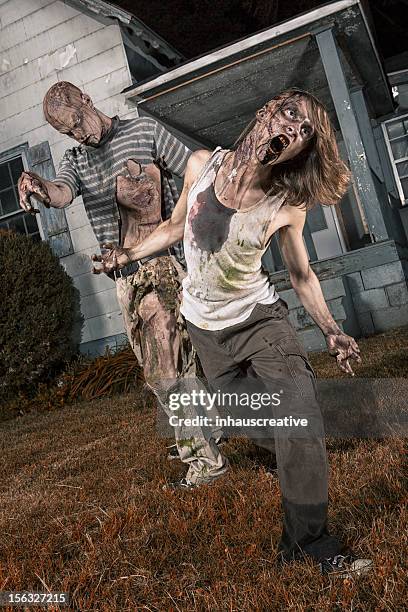 pictures of real classic zombies outside a old farmhouse - zombie stock pictures, royalty-free photos & images