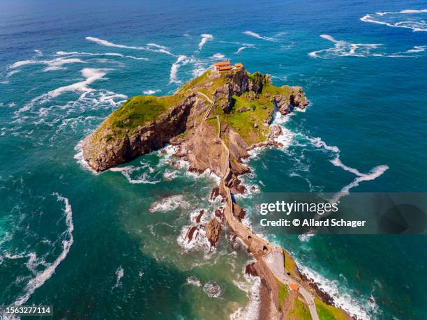 aerial view on islet of gaztelugatxe spain - gaztelugatxe fotografías e imágenes de stock