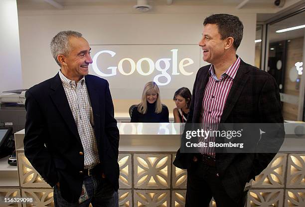 Patrick Pichette, chief financial officer of Google Inc., left, and Chris O'Neil, managing director of Google Inc. Canada, share a laugh at the front...