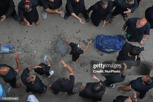 Shiite mourners gather to participate in an Ashura procession on 10th of Muharram, the first month of Islamic Calendar, in Srinagar, Kashmir on July...