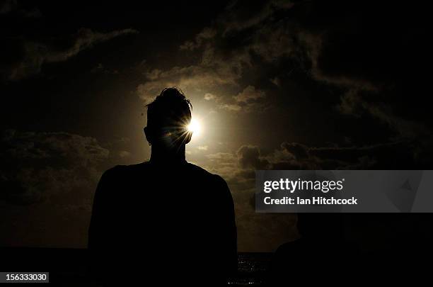 Spectator views the solar eclipse on November 14, 2012 in Palm Cove, Australia. Thousands of eclipse-watchers have gathered in part of North...