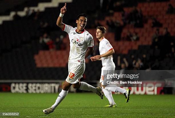 Adam Chicksen of MK Dons celebrates after scoring his team's sixth goal of the game during the FA Cup First Round Replay match between MK Dons and...
