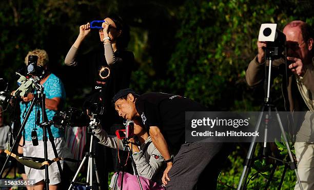 Spectators view the total solar eclipse on November 14, 2012 in Palm Cove, Australia. Thousands of eclipse-watchers have gathered in part of North...