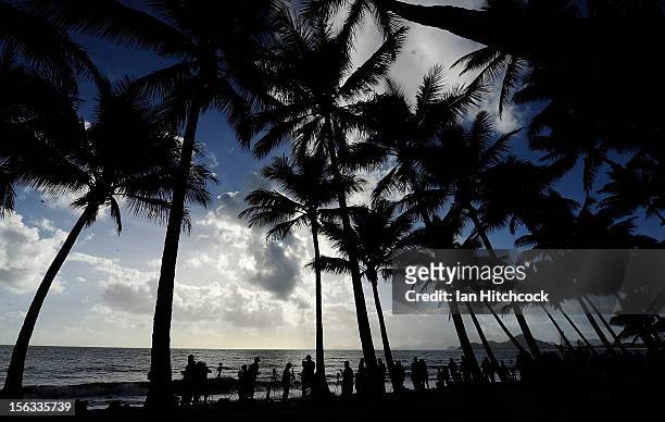 Spectators line the beach to view the total solar eclipse on November 14, 2012 in Palm Cove, Australia. Thousands of eclipse-watchers have gathered...