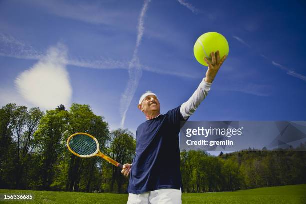 funny senior adult playing tennis - baggy green stock pictures, royalty-free photos & images