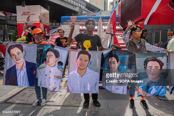 Protesters seen holding the portraits of Pita Limjaroenrat, the Move Forward party leader and the prime minister candidate during the demonstration....