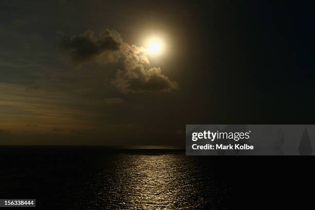 Shadow starts to fall moments before totality is seen during the solar eclipse at Vlassof Cay on November 14, 2012 in Palm Cove, Australia on...