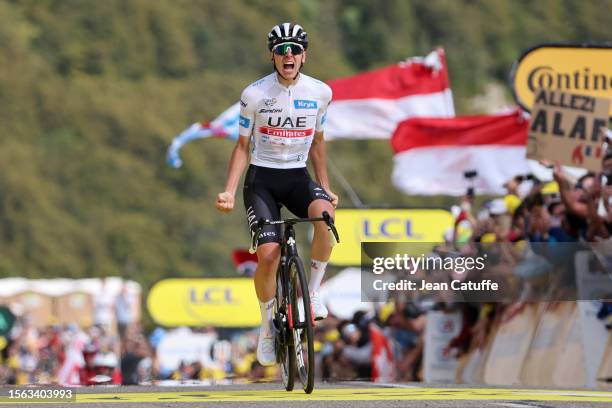 White jersey of best young rider Tadej Pogacar of Slovenia and UAE Team Emirates celebrates at finish line winning stage twenty of the 110th Tour de...