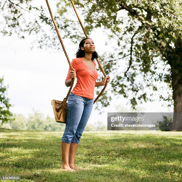 young woman in park - barefoot stock pictures, royalty-free photos & images