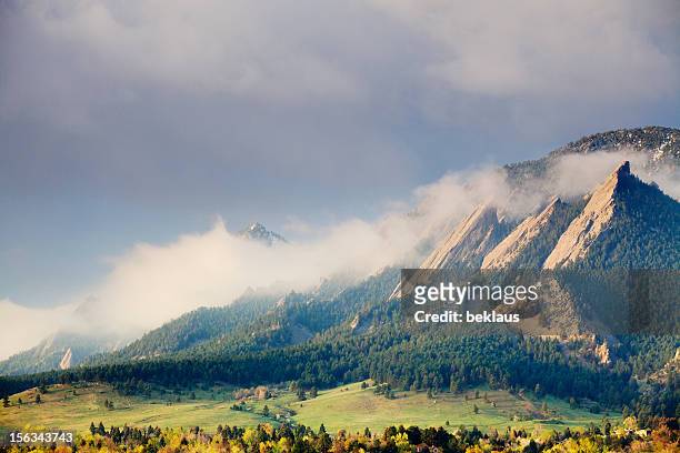 first light on the boulder colorado flatirons - denver stock pictures, royalty-free photos & images