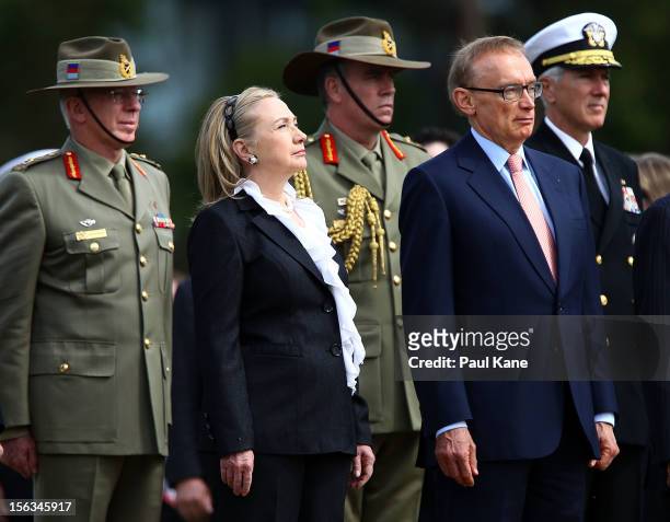 Secretary of State Hillary Clinton and Australian Minister for Foreign Affairs Bob Carr stand to attention during awreath laying ceremony at Kings...