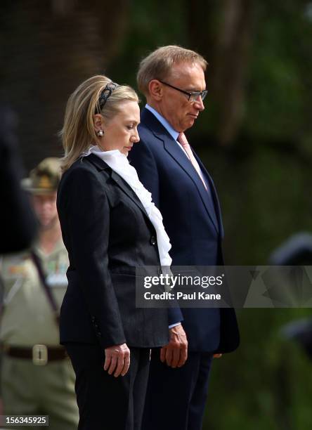 Secretary of State Hillary Clinton and Australian Minister for Foreign Affairs Bob Carr stand to attention during awreath laying ceremony at Kings...