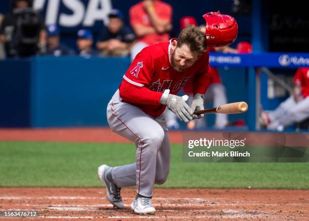 Taylor Ward of the Los Angeles Angels reacts after being hit by a pitch during the fifth inning in their MLB game against the Toronto Blue Jays at...