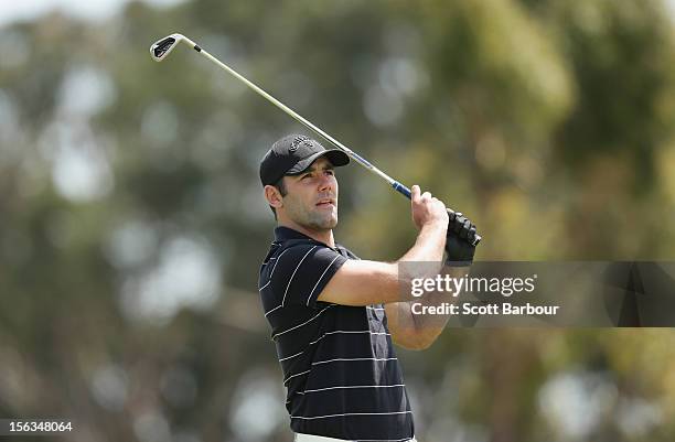 Rugby League player Cameron Smith hits an approach shot during the Pro-Am Day ahead of the 2012 Australian Masters at Kingston Heath Golf Club on...