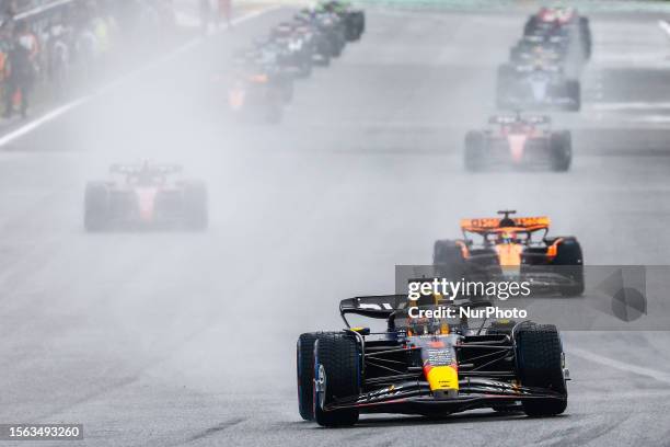 Max Verstappen of Red Bull Racing and Oscar Piastri of McLaren during the Sprint ahead of the F1 Grand Prix of Belgium at Circuit de...