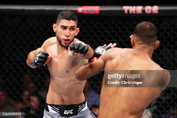 Fares Ziam of France punches Jai Herbert of England in their lightweight fight during the UFC Fight Night at The O2 Arena on July 22, 2023 in London,...