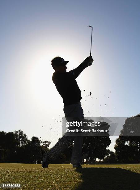 Ian Poulter of England hits an approach shot during the Pro-Am Day ahead of the 2012 Australian Masters at Kingston Heath Golf Club on November 14,...