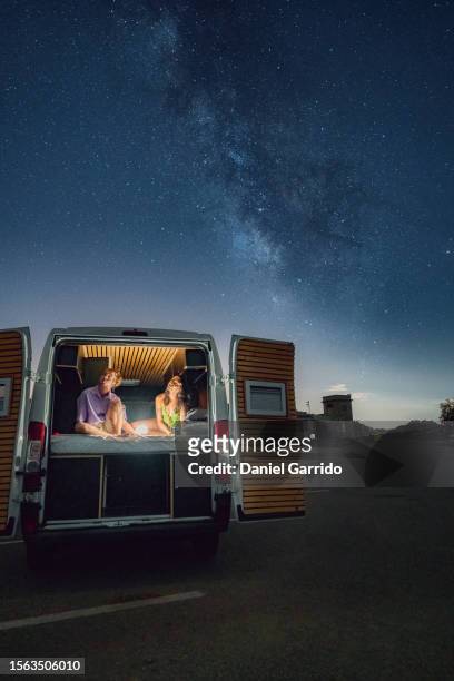 hotel of one million stars, heading for the stars in a romantic journey under the milky way, romance and adventure in the starry campervan - paraje natural torcal de antequera stock pictures, royalty-free photos & images
