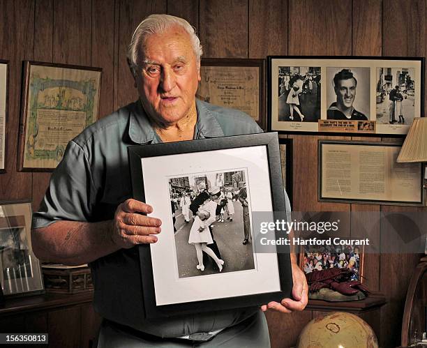 George Mendonsa holds one of the most iconic photographs of the 20th century at his Middletown, Rhode Island home, October 2,3 2012. In the...