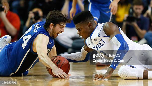 Nerlens Noel of the Kentucky Wildcats and Ryan Kelly of the Duke Blue Devils battle for a loose ball during the 2012 State Farm Champions Classic at...