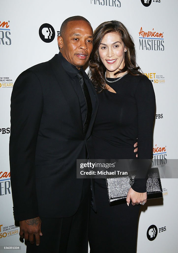 Dr. Dre and Nicole Threatt arrive at the Los Angeles premiere of