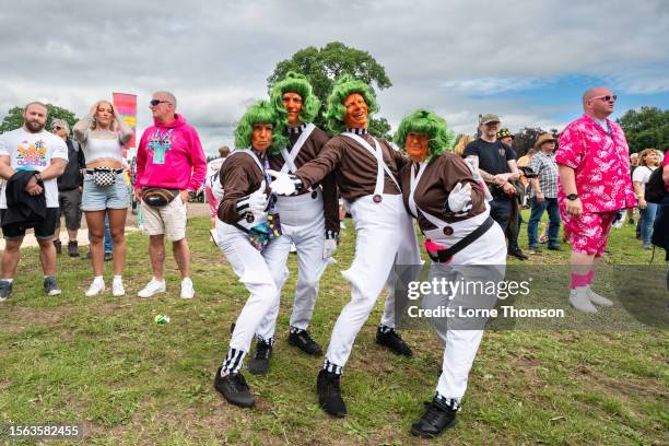 Festivalgoers dressed as Oompa Loompa's pose during Rewind Scotland Festival 2023 at Scone Palace on July 22, 2023 in Perth, Scotland.