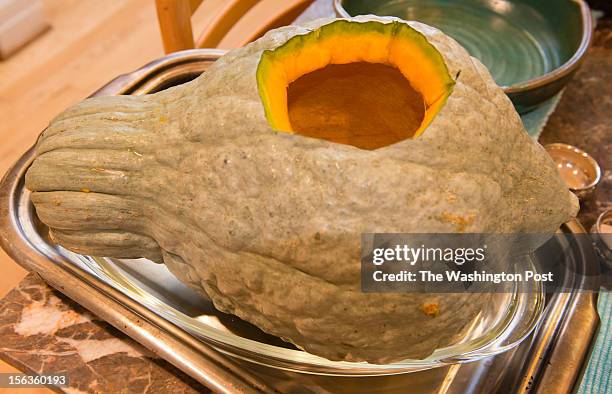 Resident Lisa Jorgenson puts together a s stuffed vegetarian Hubbard squash. The squash is shown before it is baked.